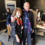 At the event, Mrs. Cooper was wearing an Aurora scarf and holding an artistic umbrella with the same scarf.