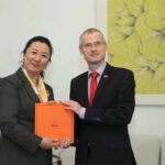 Mr. Tong Fude, the current Czech Ambassador to China, is standing on the Aurora Silk Road platform at the Czech Embassy