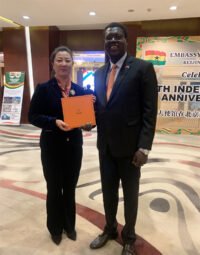 South Sudan's Ambassador to China, Kunba Your Excellency Meng Dai, give a thumbs up for the Aurora scarf platform