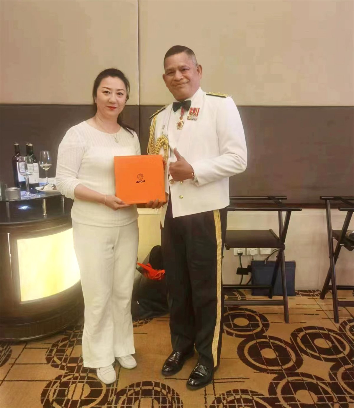 Mr. Zahid, a Malaysian military officer, stood on the platform for Aurora scarves