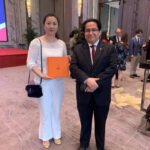 His Excellency David Gamara, Consul General of Peru in Shanghai, stands at the Aurora scarf platform