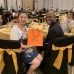 Grenada's two ambassadors to China stand on the Aurora platform for the Silk Road