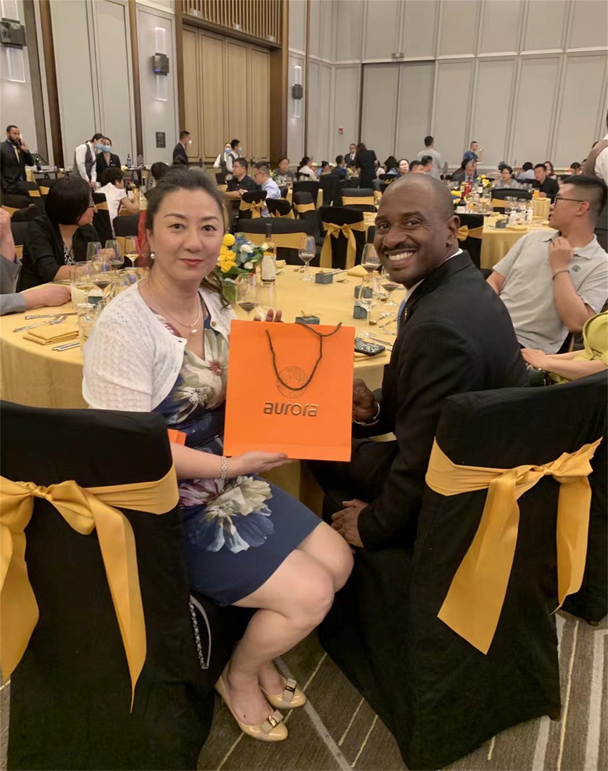 Grenada's two ambassadors to China stand on the Aurora platform for the Silk Road